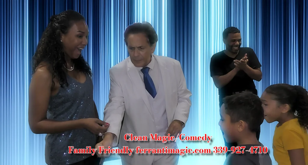 Comedy Magic Boston Magician Joe Ferranti The Best in Magic Entertainment A photo of Boston Magician joe Ferranti performing his Magiccomedy show in a home in Milton Massachusetts Also in the picture are two adults and two children with big smiles and positive reactions to the magic